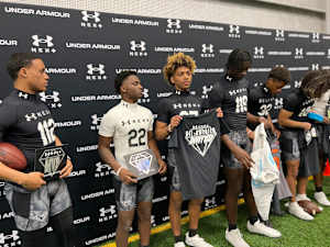 KJ Lacey (center) gains an invite to the Under Armour All-America Game